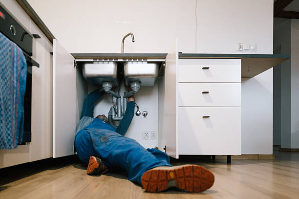 Professional Emergency Plumber technician working in Bath, IN